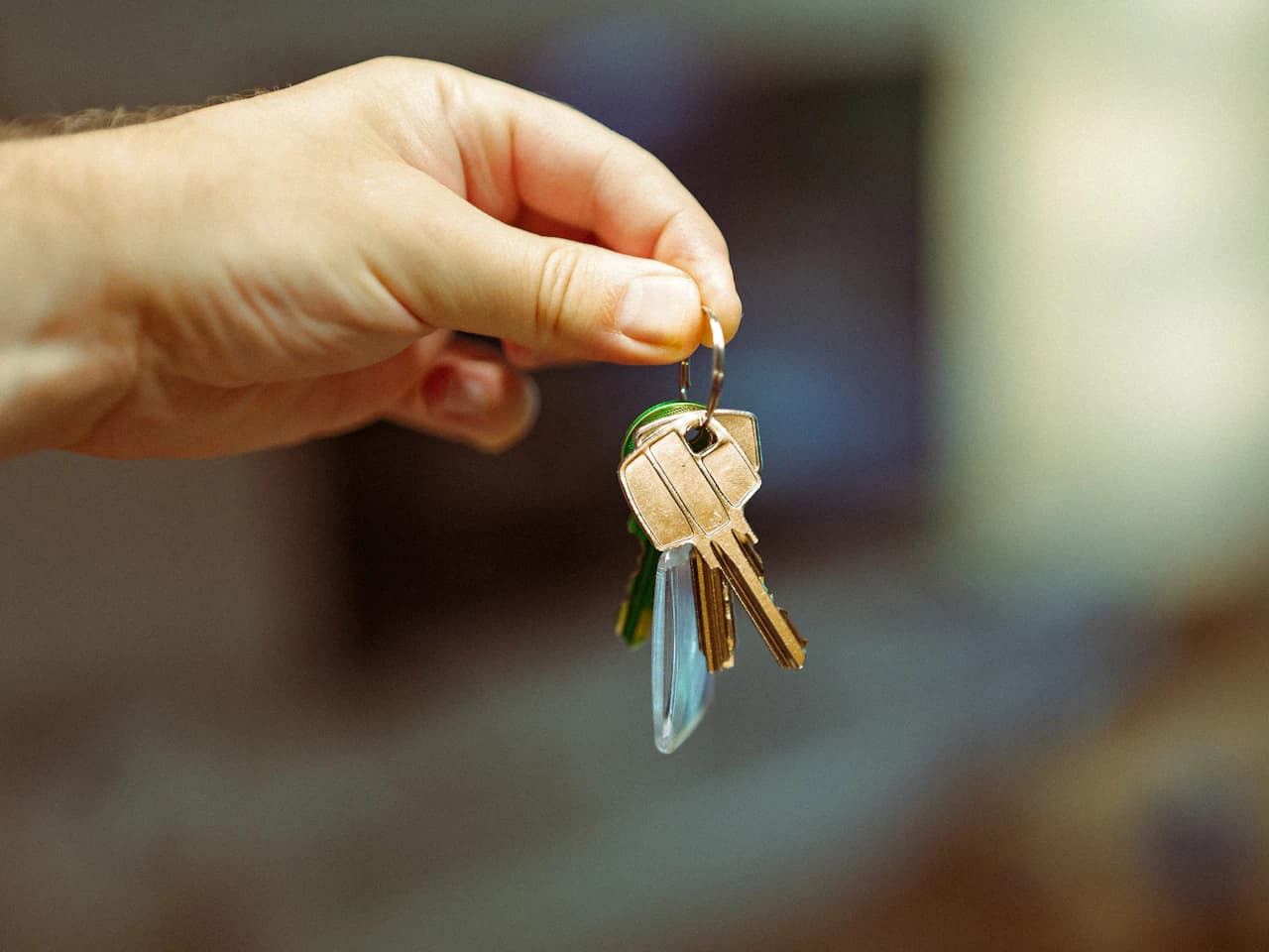 Person holding keys after a locksmith job is complete